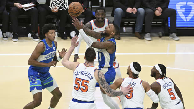 Milwaukee Bucks guard Damian Lillard (0) drives to the basket against New York Knicks 